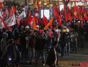 Demonstrators gather in Ankara, Turkey, Tuesday, Sept. 10, 2013, to protest the death of Ahmet Atakan in Antakya on Monday night. Hundreds of demonstrators clashed with police in southern Turkey on Tuesday following a funeral for a 22-year-old protester whose death provoked calls for a revival of the massive anti-government protests that swept the country over the summer. (Photo: AP /Burhan Ozbilici)
