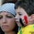 A Lebanese member the Syrian Social Nationalist Party carries her son with colors of the Syrian national flag is painted on his face, during a demonstration against a possible military strike in Syria, in front of the United Nations headquarters, in Beirut, Lebanon, Sunday, Sept. 8, 2013. The White House is making a big push to rally members of Congress and the American public behind President Barack Obama's plan for a U.S. military strike against Syria. His administration says the government of Assad used chemical weapons in an attack last month near Damascus, and that a strong U.S. response is needed to deter the future use of deadly chemicals. (Photo: AP/Bilal Hussein)