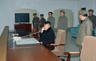 Kim Jong-un talks in front of his military aides and other high-ranking officials, including his Jang Song-thaek who was executed last December / YONHAP PHOTO