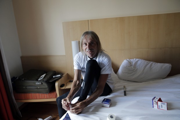 Alain Robert, also known as the French Spiderman, prepares to climb the Montparnasse tower a 210-metre (689 ft) office skyscraper located in the Montparnasse area of Paris, France, Tuesday, April 28, 2015. Robert decided to climb in solidarity with the victims of the Saturday's earthquake in Nepal. (AP Photo)