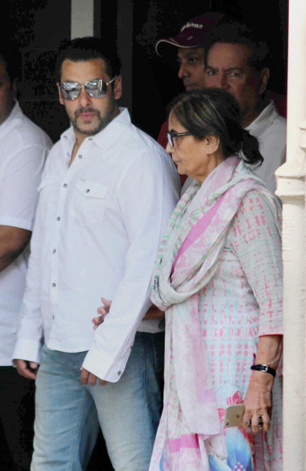 Bollywood actor Salman Khan walks with his mother Sushila Charak as he leaves home for court in Mumbai, India, Wednesday, May 6, 2015. One of India's biggest and most popular movie stars, Salman Khan, was on Wednesday, May 6, 2015, sentenced to five years in jail after he was found guilty of running over five men sleeping on a sidewalk, killing one in a hit-and-run case that has dragged through the courts for more than 12 years. (Press Trust of India via AP) 