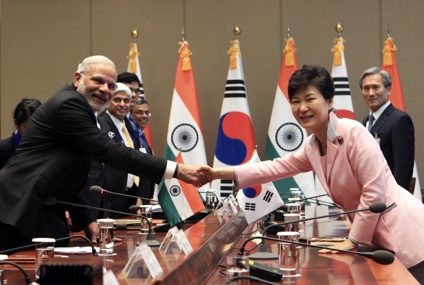 Indian Prime Minister Narendra Modi, left, shakes hands with South Korean President Park Geun-hye during a meeting at the presidential Blue House Monday, May 18, 2015 in Seoul, South Korea. (Photo via AP)