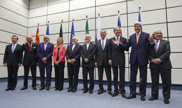 From left to right, Chinese Foreign Minister Wang Yi, French Foreign Minister Laurent Fabius, German Foreign Minister Frank Walter Steinmeier, European Union High Representative for Foreign Affairs and Security Policy Federica Mogherini, Iranian Foreign Minister Mohammad Javad Zarif, Head of the Iranian Atomic Energy Organization Ali Akbar Salehi, Russian Foreign Minister Sergey Lavrov, British Foreign Secretary Philip Hammon, U.S. Secretary of State John Kerry and U.S. Secretary of Energy Ernest Moniz pose for a group picture at the United Nations building in Vienna, Austria, Tuesday, July 14, 2015. After 18 days of intense and often fractious negotiation, world powers and Iran struck a landmark deal Tuesday to curb Iran's nuclear program in exchange for billions of dollars in relief from international sanctions ó an agreement designed to avert the threat of a nuclear-armed Iran and another U.S. military intervention in the Muslim world. (AP)