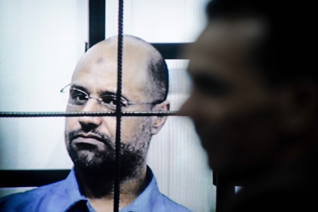 This file photo taken on April 27, 2014 shows Saif al-Islam Gaddafi on trial via video-conference software in a courtroom in Zintan, Libya. A Libyan court on Tuesday sentenced Saif al-Islam Gaddafi, son of the former leader Muammar Gaddafi, to death, according to local judicial resources. (Xinhua/Zhang Yuan)
