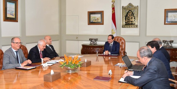 Eni CEO Claudio Descalzi, third left, and his delegation meet with Egyptian President Abdel-Fattah el-Sissi, center, and an Egyptian delegation, in Cairo, Egypt. The Italian energy company Eni SpA announced Sunday, Aug. 30, 2015, it has discovered a "supergiant" natural gas field off Egypt, describing it as the "largest-ever" found in the Mediterranean Sea. Eni said the discovery ? made in its Zohr prospect "in the deep waters of Egypt" ? could hold a potential 30 trillion cubic feet of gas over an area of 100 square kilometers (38.6 square miles). (MEAN via AP)
