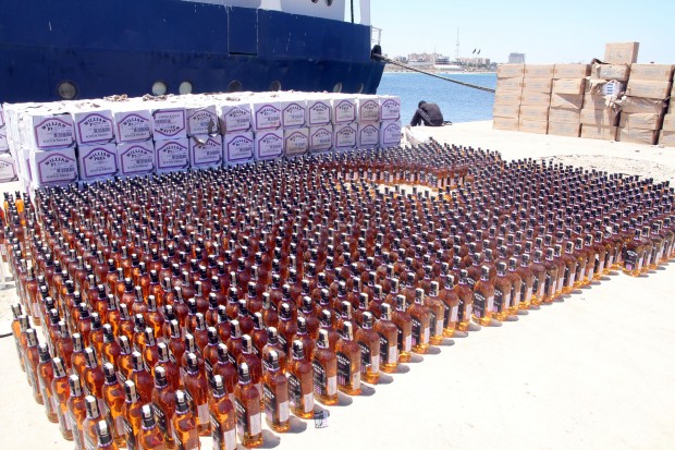 Boxes of wine are piled up in Tripoli harbour on May 30, 2014, in Tripoli, Libya. Libya's coast guards on Friday showed a batch of alcohol seized during their patrol off coast. Alcohol prohibition is enforced in the Islamic state of Libya. (Xinhua/Hamza Turkia) 