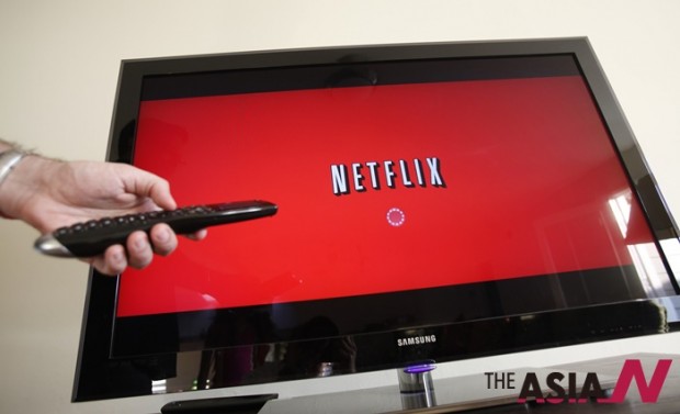 In this July 20, 2010 file photo, a person uses Netflix in Palo Alto. (AP Photo/Paul Sakuma, File) 