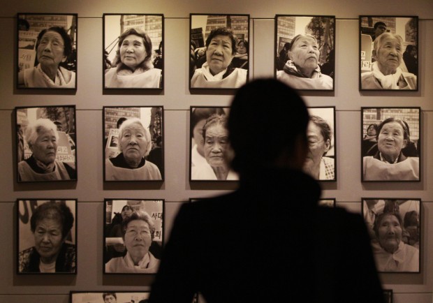 portraits of late former "comfort women" who were forced to serve for the Japanese troops as a sexual slave during World War II. (AP Photo/Ahn Young-joon, File) 