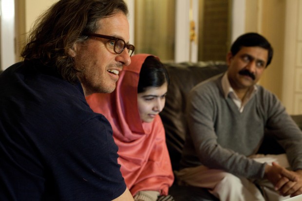 In this Dec. 17, 2013 photo released by Twentieth Century Fox Film Corporation, director Davis Guggenheim appears in Birmingham, England with Malala Yousafzai, and Ziauddinuddin Yousafzai during the filming of the documentary, "He Named Me Malala," released in U.S. theaters on Friday. (Caroline Furneaux/Twentieth Century Fox Film Corporation via AP)