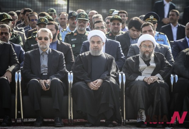 Iranian President Hassan Rouhani (front C) attends a ceremony to pay tribute to Iranian pilgrims killed in the latest Hajj stampede and transferred to Mehrabad airport in Tehran, capital of Iran, on Oct. 3, 2015. Rouhani on Saturday urged for an investigation into the latest Hajj stampede in Saudi Arabia which left 465 Iranian pilgrims dead. (Xinhua/Ahmad Halabisaz) 