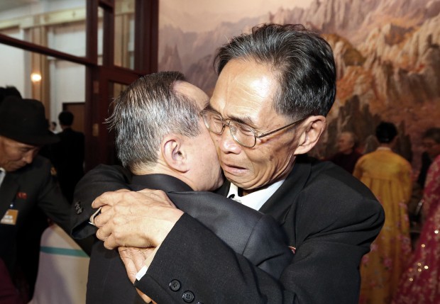 North Korean Joo Jae Eun, right, hugs with his South Korean brother Joo Jae-hui in a bid farewell after the Separated Family Reunion Meeting at Diamond Mountain resort in North Korea, Monday, Oct. 26, 2015. Parents and children, brothers and sisters and other relatives separated by the Korean war wept and hugged each other as they parted after their brief reunions, most for the first time in more than six decades. (Kim Do-hoon/Yonhap via AP) 