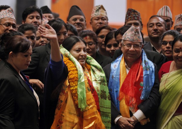 Bidhya Devi Bhandari of the Communist Party of Nepal Unified Marxist-Leninist waves her hand after she was elected as Nepal's new president in Kathmandu, Nepal, Wednesday, Oct. 28, 2015. Bhandari, 54, who has long campaigned for women's rights was elected Wednesday as Nepal's first female president. (AP Photo/Niranjan Shrestha)