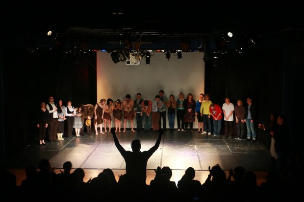 Actors gather on stage after the performance at the end of day 1