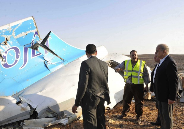 remains of a crashed passenger jet in Hassana, Egypt on Saturday, Oct. 31, 2015. The Russian aircraft carrying 224 people crashed Saturday in a remote mountainous region in the Sinai Peninsula about 20 minutes after taking off from a Red Sea resort popular with Russian tourists, the Egyptian government said. There were no survivors. (Suliman el-Oteify/Egyptian Prime Minister's Office via AP)