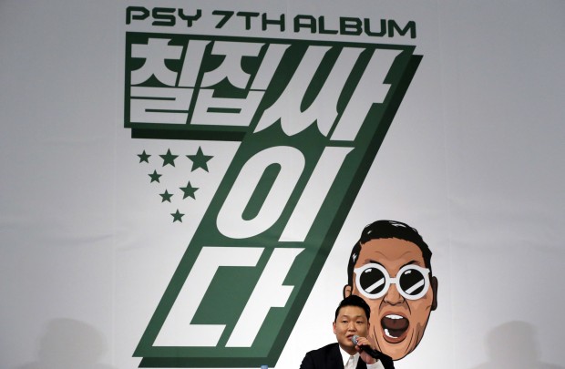 South Korean singer PSY answers a reporter's question during a news conference on the release of his seventh album in Seoul, South Korea, Monday, Nov. 30, 2015. PSY has become globally famous with his 2012 hit song "Gangnam Style," which shattered YouTube viewing records. (AP Photo/Lee Jin-man) 