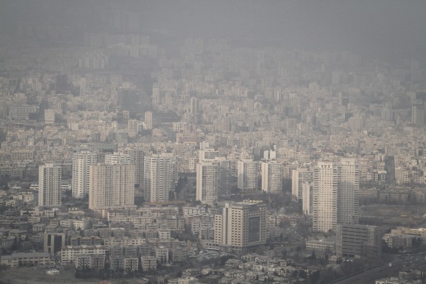 smog-enveloped Tehran, Iran. Iran's government announced that all schools and kindergartens of Tehran close on Dec. 20 and 21, due to the alarming high air pollution in the city. (Xinhua/Ahmad Halabisaz)