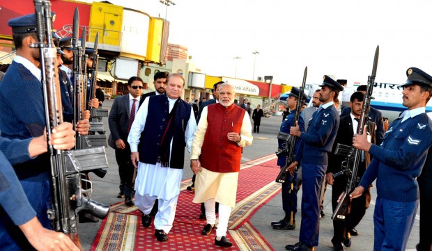 In this photo released by Press Information Department, India's Prime Minister Narendra Modi, right, reviews guard of honor with his Pakistani counterpart Nawaz Sharif in Lahore, Pakistan, Friday, Dec. 25, 2015. Modi arrived in Pakistan on Friday, his first visit as prime minister to this Islamic nation that has been India's long-standing archrival in the region. (AP Photo/Press Information Department)