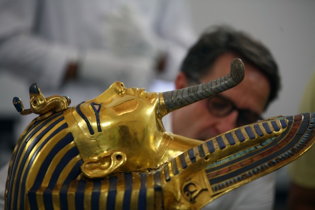German archaeologist Christian Eckmann during his work on the restoration process of the golden mask of Tutankhamun at the Egyptian Museum in Cairo, Egypt, Oct. 20, 2015. (Xinhua/Ahmed Gomaa)