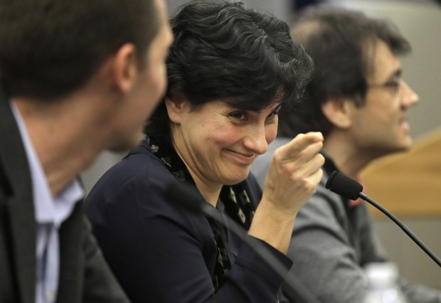Massachusetts Institute of Technology astrophysics professor Nergis Mavalvala, center, addresses an audience of scientists and journalists as MIT physics professor Matthew Evans, left, and MIT research scientist Erik Katsavounidis, right, look on during a presentation on the discovery of gravitational waves, Thursday, Feb. 11, 2016, on the school's campus, in Cambridge, Mass. In a blockbuster announcement, scientists said after decades of trying they have finally detected faint ripples of gravity reverberating invisibly through the fabric of both space and time, just as Einstein predicted. (AP Photo/Steven Senne)