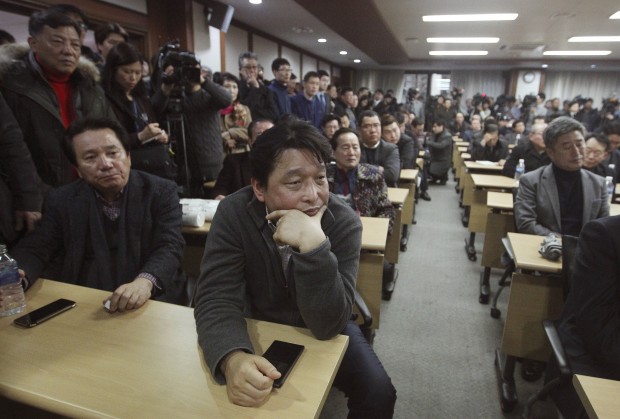 South Korean owners who run factories in the suspended inter-Korean Kaesong Industrial Complex, attend an emergency meeting held by the council of South Korean companies operating in the industrial park, in Seoul, South Korea, Friday, Feb. 12, 2016. North Korea on Thursday ordered a military takeover of a factory park that had been the last major symbol of cooperation with South Korea, calling Seoul's earlier suspension of operations at the jointly run facility as punishment for the North's recent rocket launch a "dangerous declaration of war."(AP Photo/Ahnn Young-joon)
