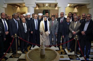 Saudi Ambassador to Lebanon Ali Awad Assiri, center, poses for a photograph with Lebanese politicians during their visit to express their solidarity with the Kingdom of Saudi Arabia, at the Saudi Embassy in Beirut, Lebanon, Wednesday, Feb. 24, 2016. (AP Photo/Bilal Hussein)