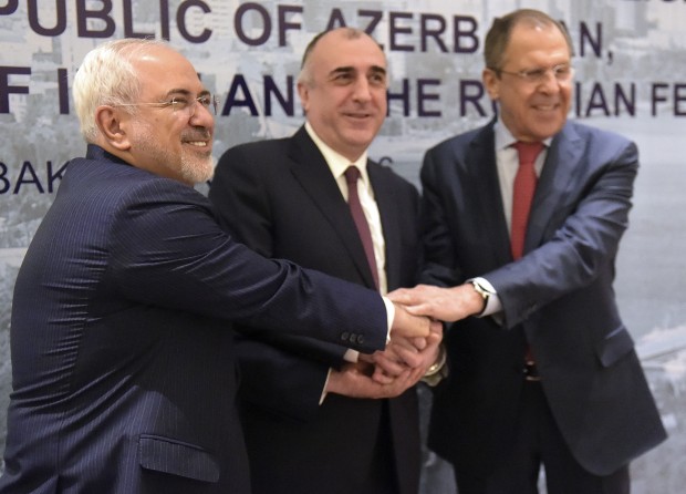 During a meeting of regional powers, from left: Iranian Foreign Minister Mohammad Javad Zarif, Azerbaijan's Foreign Minister Elmar Mammadyarov and Russian Foreign Minister Sergey Lavrov, shake hands in Baku, Azerbaijan, on Thursday, April 7, 2016. The foreign ministers of Russia and Iran joined efforts on Thursday to prevent a new war between Azerbaijani and Armenian forces over Nagorno-Karabakh, while both sides in the conflict accused the other of violating a two-day-old cease-fire. (AP Photo)