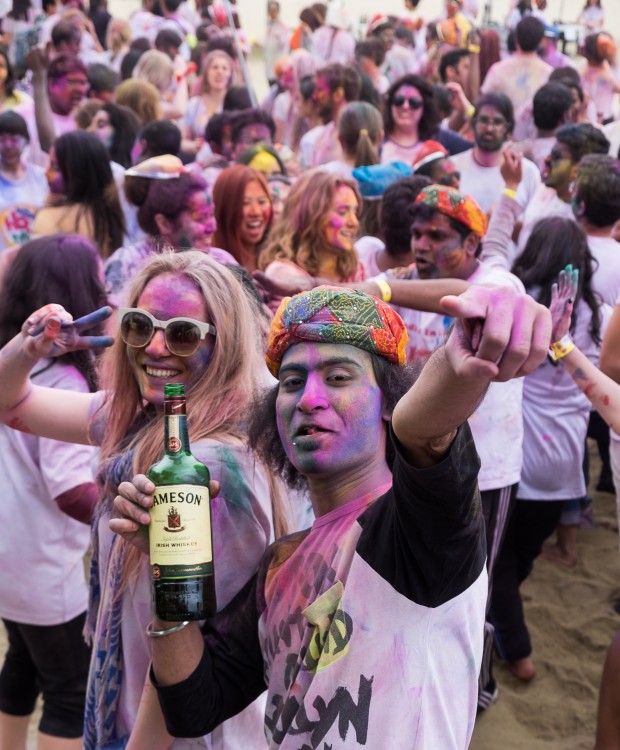 A bottle of Jameson and colors to celebrate the occasion of Holi.
