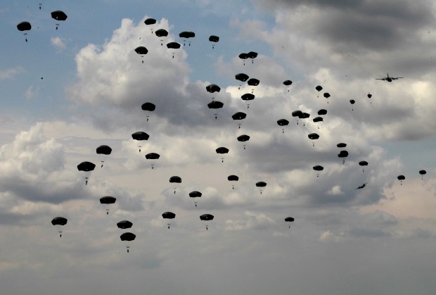 US airborne troops participate in joint military exercises of U.S, British and Georgian troops at the Vaziani military base outside Tbilisi, Georgia, Wednesday, May 11, 2016. About 1,300 U.S., British and Georgian troops are conducting joint exercises aimed at training the former Soviet republic's military for participation in the NATO Response Force. (AP Photo/Shakh Aivazov)