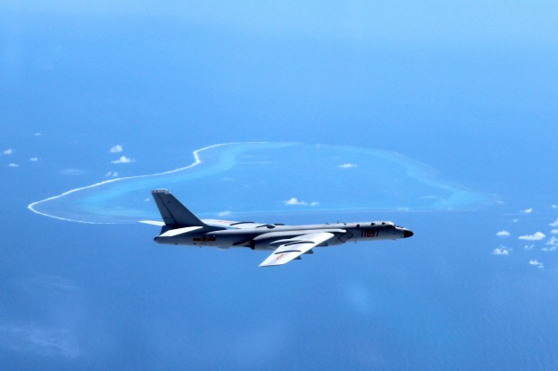 In this undated photo released by Xinhua News Agency, a Chinese H-6K bomber patrols the islands and reefs in the South China Sea. China is closing off a part of the South China Sea for military exercises this week, the government said Monday, July 18, 2016, days after an international tribunal ruled against Beijing's claim to ownership of virtually the entire strategic waterway. (Liu Rui/Xinhua via AP) NO SALES