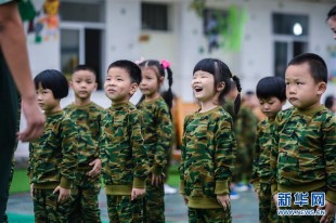 (People's Daily) One hundred kindergarteners in Changxing County, Zhejiang province attended a week-long "military training" session beginning on Sept. 7, just before entering primary school. The training is meant to help children become stronger and more self-reliant. (Photo/Xinhua)