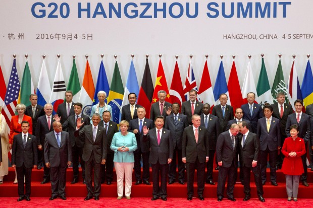 State leaders take part in a group photo session for the G20 Summit held at the Hangzhou International Expo Center in Hangzhou in eastern China's Zhejiang province, Sunday, Sept. 4, 2016. (AP Photo/Ng Han Guan)