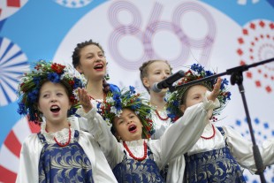 Performers sing at a concert in a park during celebrations marking the Day of the City in Moscow, Russia, on Saturday, Sept. 10, 2016. Moscow's official history marks 869th anniversary today. (AP Photo/Ivan Sekretarev)