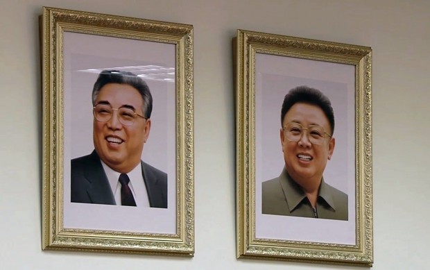 In this image made from video taken Wednesday, Sept. 9, 2015, portraits of former North Korean leaders Kim Jong-il, right, and Kim Il-sung, hang on a wall in a class where children from North Korea and Russia study together in Khabarovsk, Russia's Far East. The class, with seven students from North Korea, is taking part in a new program in the city of Khabarovsk that aims to promote cultural understanding between the neighboring countries. (AP Photo)