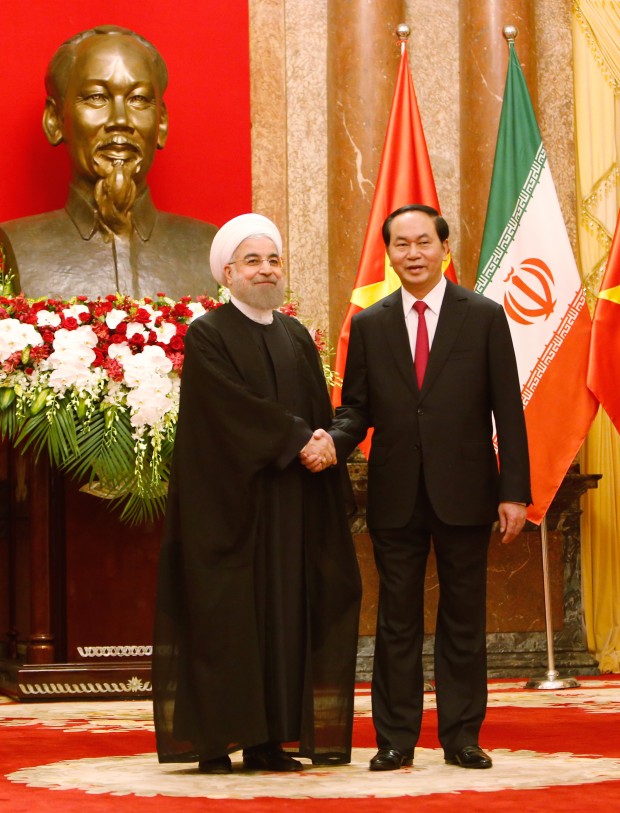 Iranian President Hassan Rouhani, left, shakes hands with his Vietnamese counterpart Tran Dai Quang in Hanoi, Vietnam, Thursday, Oct. 6, 2016, before heading for talks. Rouhani is on a two-day visit to the Southeast Asian country to boost ties between the two countries. (AP Photo/Tran Van Minh)