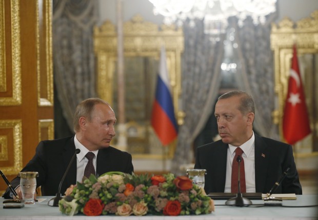 Turkey's President Recep Tayyip Erdogan, right and Russian President Vladimir Putin, left, look at each other during a news conference following their meeting in Istanbul, Monday, Oct. 10, 2016. Putin and Erdogan voiced support for the construction of a gas pipeline from Russia to Turkey, called Turkish Stream, a project that was suspended amid tensions between the two countries. The pipeline would carry Russian natural gas to Turkey and onto European Union countries. (AP Photo/Emrah Gurel)