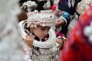 QIANDONGNAN, Oct. 12, 2016 (Xinhua) -- A performer presents traditional costumes of Miao ethnic group in Jianhe County, southwest China's Guizhou Province, Oct. 12, 2016. Teams from 15 townships under Jianhe County participated in the show to present traditional costumes. (Xinhua/Yang Wenbin) (zyd)