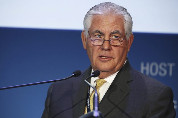 FILE - In this Nov. 7, 2016, file photo, ExxonMobil CEO and chairman Rex W. Tillerson gives a speech at the annual Abu Dhabi International Petroleum Exhibition & Conference in Abu Dhabi, United Arab Emirates. Throughout the presidential campaign, the Bush family and many of its Republican allies turned their backs on Donald Trump. Now, they’re finding common cause with Trump over his pick to lead the State Department: Tillerson, who has long orbited their same political, philanthropic and business circles. (AP Photo/Jon Gambrell, File)