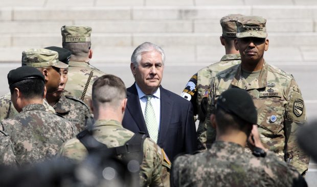 U.S. Secretary of State Rex Tillerson, center, visits with U.S. Gen. Vincent K. Brooks, commander of the United Nations Command, Combined Forces Command and United States Forces Korea, right, at the border village of Panmunjom, which has separated the two Koreas since the Korean War, South Korea, Friday, March 17, 2017. (AP Photo/Lee Jin-man, Pool)