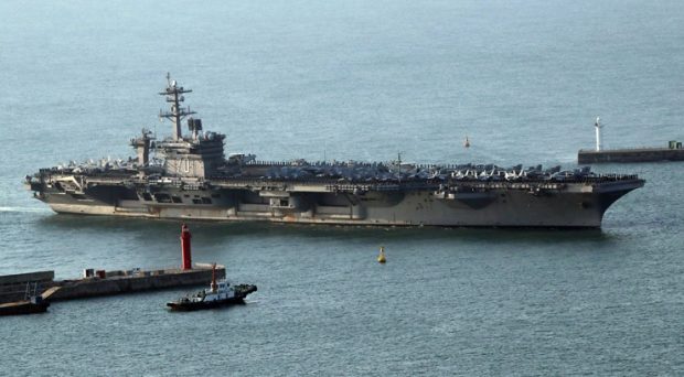 The USS Carl Vinson supercarrier arrives at a port in Busan, 15 March. The Carl Vinson U.S. Navy Strike Group, which includes the USS Carl Vinson (CVN 70), is moving toward the Korean peninsula to provide a 'show of force' against North Korea in the wake of North Korean ballistic missile tests and reported increased activity at North Korea's nuclear test site. / EPA-Yonhap
