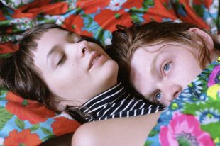 “Chris and Sarah in Bed of Flowers” by Andrew Lyman (courtesy of D Museum)