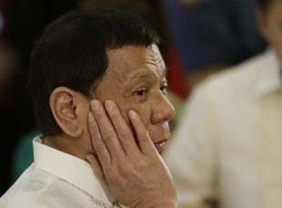On wednesday, Aug. 16, 2017, Philippine President Rodrigo Duterte visits victims of fire at the Malacanang compound in Manila, Philippines. Philippine police say they have killed at least 26 more drug offenders in overnight gun battles in the capital which brought the death toll in the president's renewed crackdown to 58 in the last three days.  