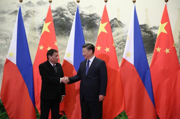 President Rodrigo Roa Duterte and People’s Republic of China President Xi Jinping shake hands prior to their bilateral meetings at the Great Hall of the People in Beijing on October 20. Photo by King Rodriguez/PPD
