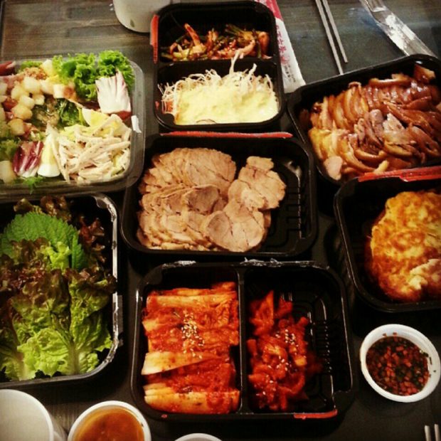 delivery_food_with_kimchi_meat_and_salads