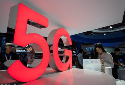 Visitors browse latest information about China's 5G technology at an event held in Guangzhou on March 1st. Photo: CFP