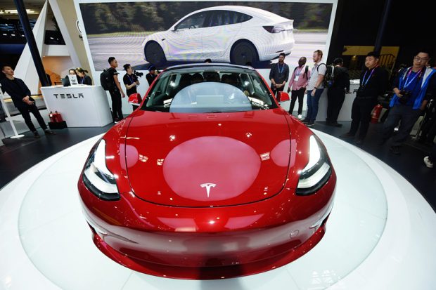 The photo shows a Tesla Model 3 at a car exhibition in Beijing, April 25, 2018. (Photo: People’s Daily Online)