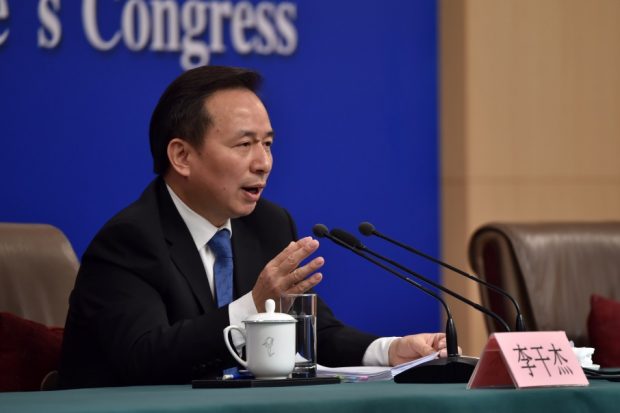 (China’s Ecology and Environment Minister Li Ganjie is answering questions from the journalists on March 11. Photo: Weng Qiyu, People’s Daily Online) 