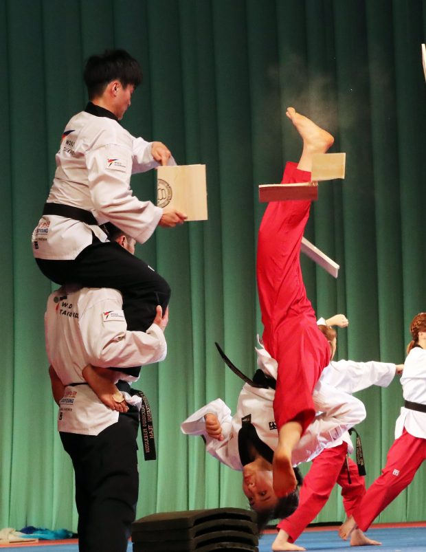 epa06641605 Members of South Korean taekwondo demonstration team perform at the Pyongyang Grand Theatre in Pyongyang, North Korea, 02 April 2018.  A 120-member troupe of South Korean performers stages two performances in North Korea on 01 April and 03 April 2018, the first such event since 2005.  EPA/KOREA / POOL