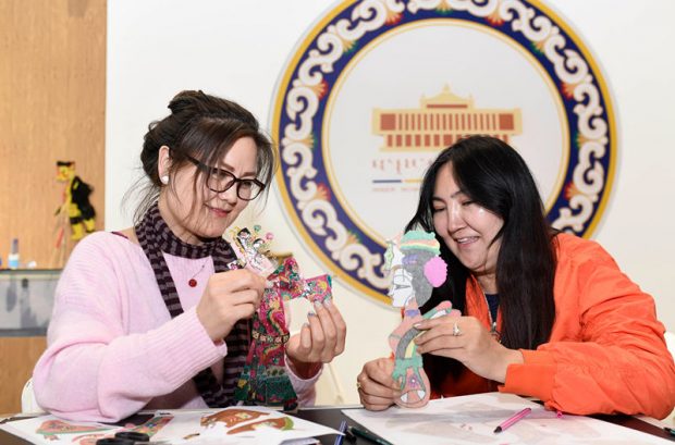 Two international students from the International Exchange College of Inner Mongolia Normal University make shadow puppets at the Inner Mongolia Exhibition Museum in Hohhot, capital of north China’s Inner Mongolia Autonomous Region, April 25, 2019. A total of 32 international students from Mongolia, Russia, Tajikistan, Laos, Cambodia, Pakistan and other countries participated in this cultural activity.