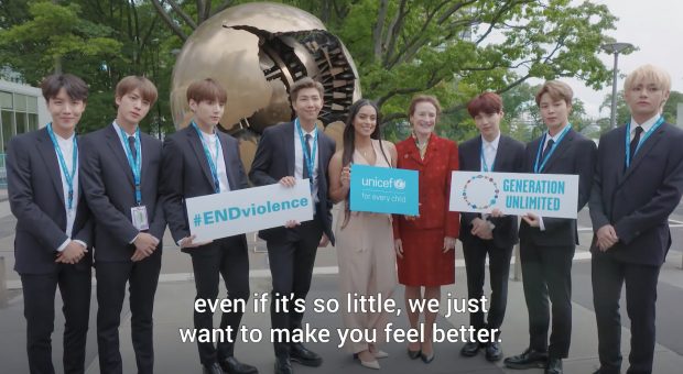 This photo captured from the UN homepage shows BTS members with a staff of UN.