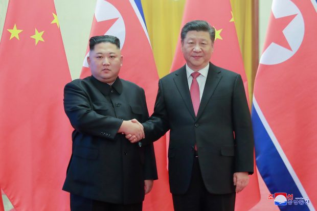 epa07272451 A photo released by the official North Korean Central News Agency (KCNA) shows North Korean leader Kim Jong-un (L) shaking hands with Chinese President Xi Jinping (R) during his visit in Beijing, China, 10 January 2019. North Korean leader Kim Jong-un is in China at the invitation of Chinese President Xi Jinping from 07 to 10 January with his wife Ri Sol-ju.  EPA/KCNA   EDITORIAL USE ONLY